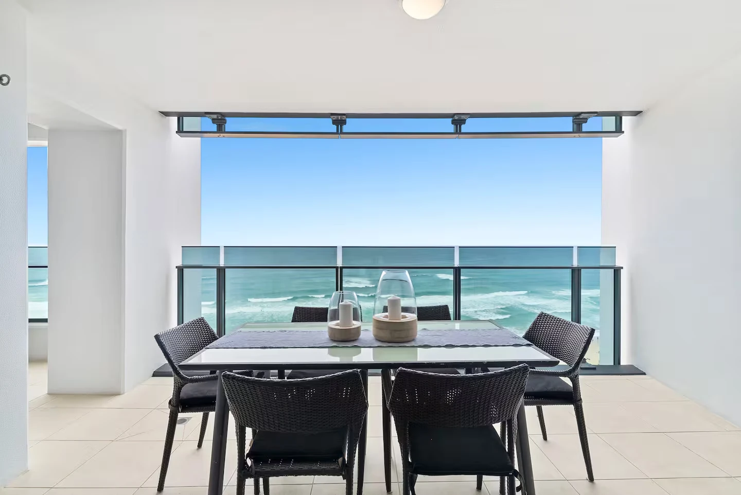 Balcony dining table overlooking the surf